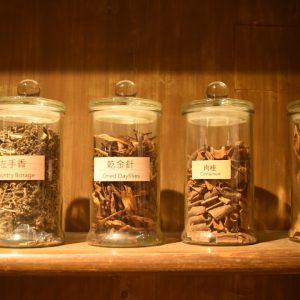 Glass jars filled with dried herbs — photo by Leandro De Torres on Unsplash