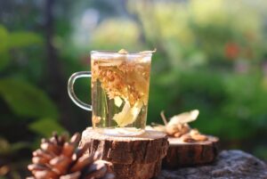 Glass of herbal tea in a natural setting